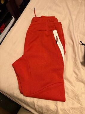 Nike Red Kids Joggers with White Zip Detail